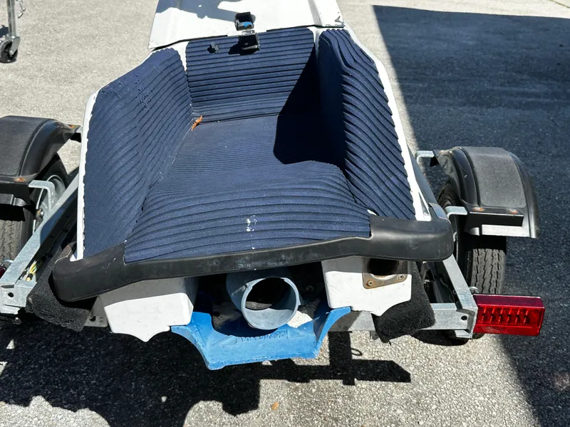 Slide: The Image of 1991 Yamaha WaveRunner Super Jet on trailer, blue seat, rear view. - 10