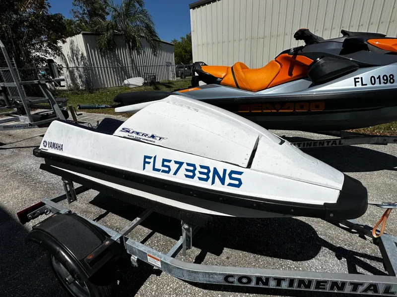 Slide: The Image of 1991 Yamaha WaveRunner Super Jet on trailer, parked outdoors. - 3
