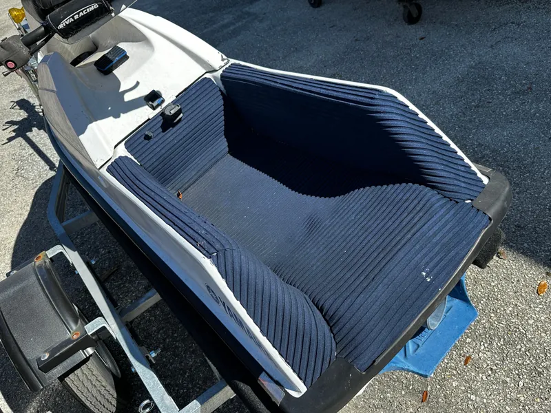 Slide: The Image of 1991 Yamaha WaveRunner Super Jet on trailer, blue seat, outdoor setting. - 9