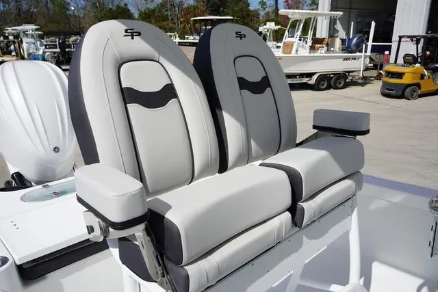 Slide: The Image of 2025 Sea Pro 250 Bay boat seats, featuring sleek gray and black design in a marina setting. - 10