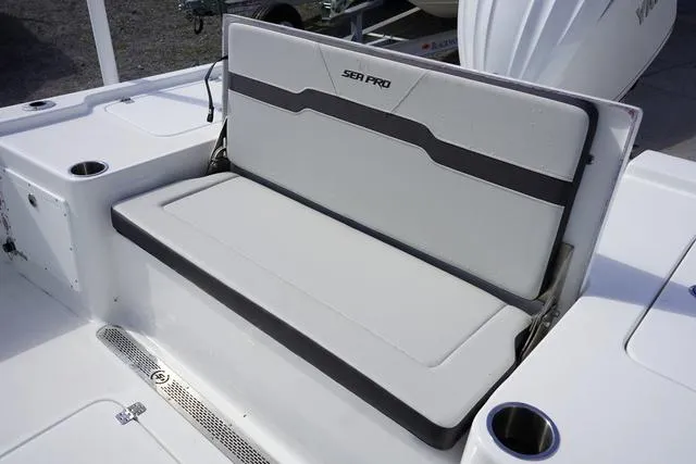 Slide: The Image of 2025 Sea Pro 250 Bay boat seat with sleek design and integrated cup holders. - 14
