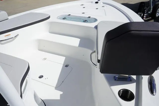 Slide: The Image of 2025 Sea Pro 250 Bay boat interior with seating and storage compartments. - 16