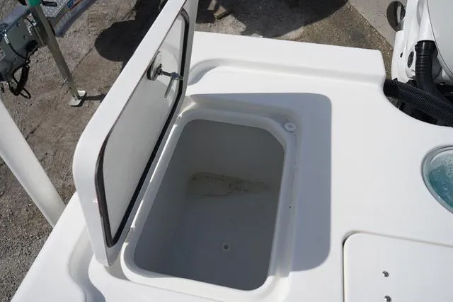 Slide: The Image of Open storage compartment on 2025 Sea Pro 250 Bay boat deck. - 17