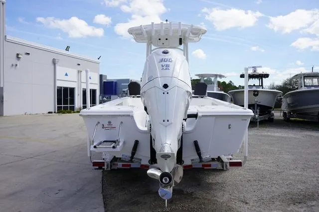 Slide: The Image of 2025 Sea Pro 250 Bay boat with powerful outboard motor, parked outdoors. - 5