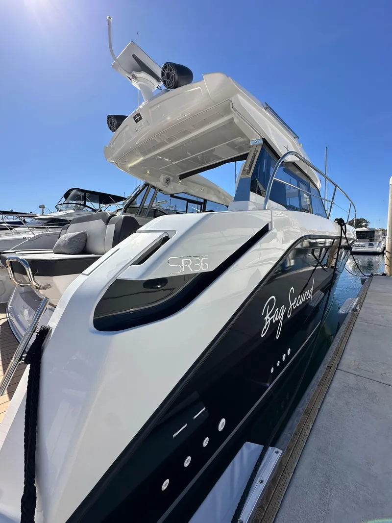 Slide: The Image of 2023 Bavaria SR36 yacht docked, showcasing sleek design and modern features. - 12