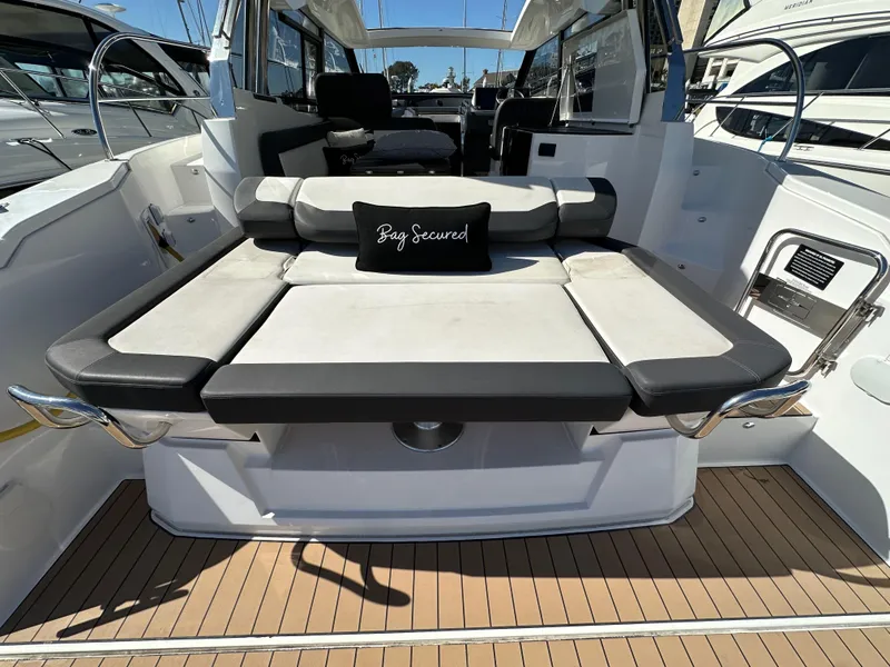 Slide: The Image of 2023 Bavaria SR36 yacht with spacious deck seating and elegant interior. - 14