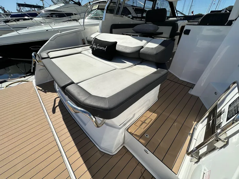 Slide: The Image of 2023 Bavaria SR36 yacht with cushioned seating on teak deck. - 15