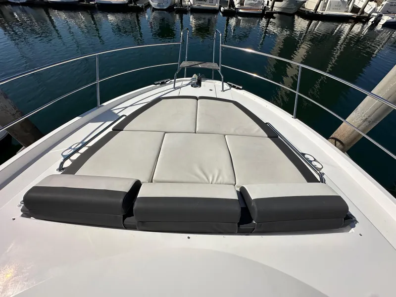 Slide: The Image of 2023 Bavaria SR36 yacht with spacious sunbathing area at the bow, docked in a marina. - 25