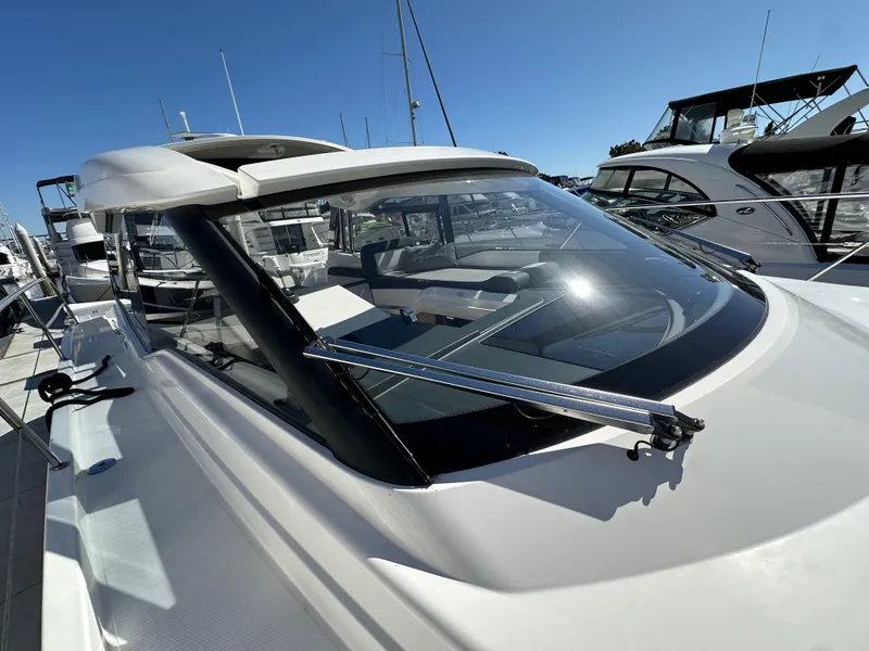 Slide: The Image of 2023 Bavaria SR36 yacht with sleek design and modern features, docked under clear blue sky. - 30