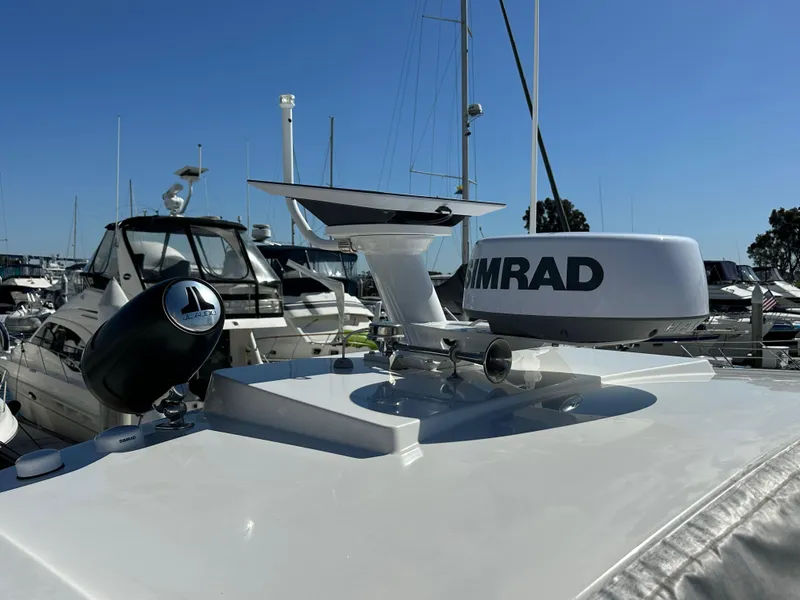Slide: The Image of 2023 Bavaria SR36 yacht with radar and navigation equipment at a marina. - 32