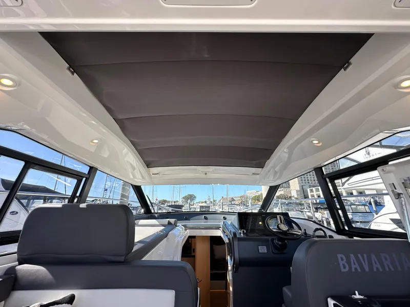 Slide: The Image of Interior view of 2023 Bavaria SR36 yacht, showcasing modern design and spacious cockpit area. - 46