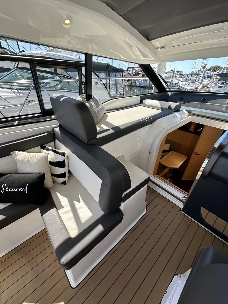 Slide: The Image of 2023 Bavaria SR36 yacht interior with modern seating and elegant design. - 47