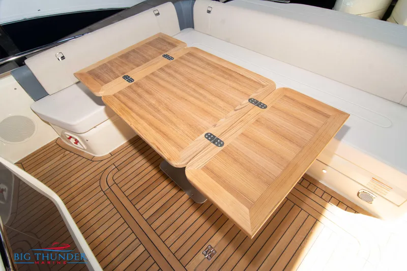 Slide: The Image of Luxurious interior of 2024 Invictus GT370S yacht with wooden table and seating. - 15