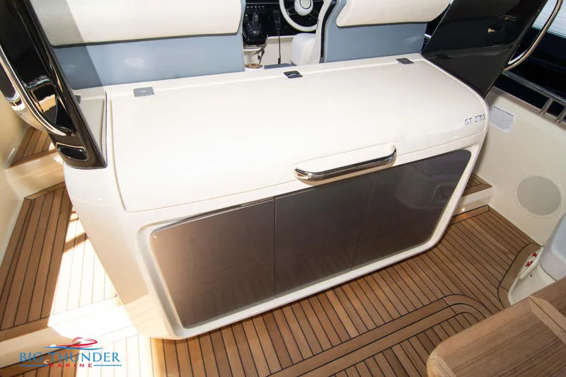 Slide: The Image of 2024 Invictus GT370S yacht interior with sleek cabinetry and modern design. - 17