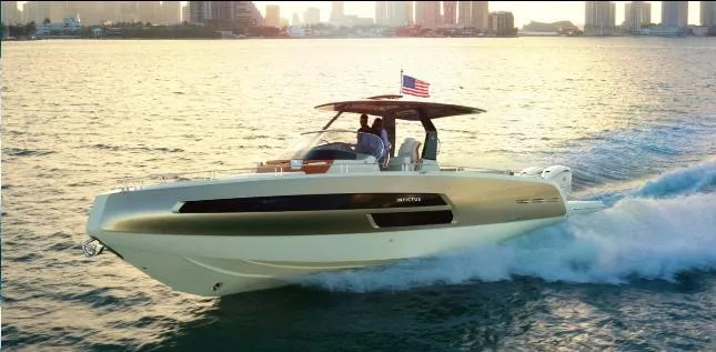 Slide: The Image of 2024 Invictus GT370S luxury yacht docked in marina, showcasing sleek design and modern features. - 2