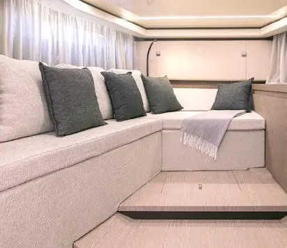 Slide: The Image of 2024 Invictus GT370S luxury boat docked at marina, featuring sleek design and powerful engines. - 3