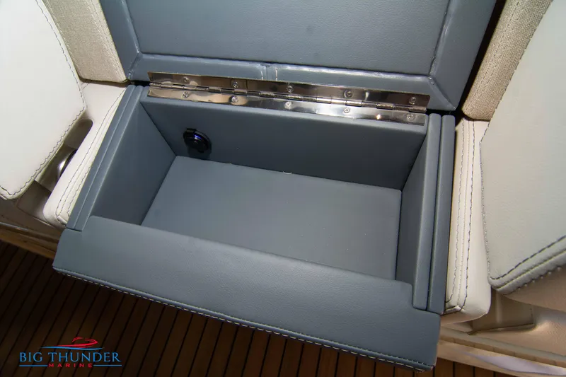 Slide: The Image of Open storage compartment in 2024 Invictus GT370S boat interior. - 42