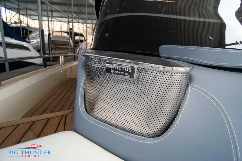 Slide: The Image of 2024 Invictus GT370S boat with premium sound system, docked at Big Thunder Marine. - 50