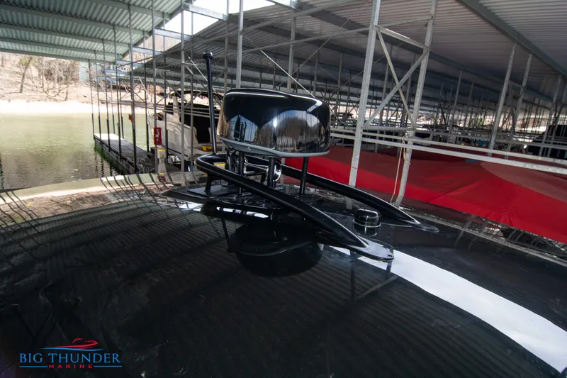 Slide: The Image of 2024 Invictus GT370S boat radar system under covered dock at Big Thunder Marine. - 51