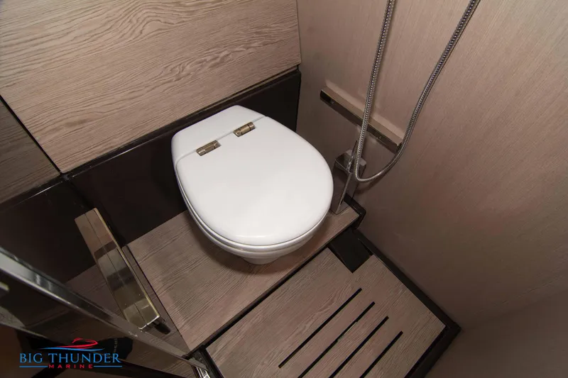 Slide: The Image of 2024 Invictus GT370S yacht bathroom with modern toilet and shower. - 53