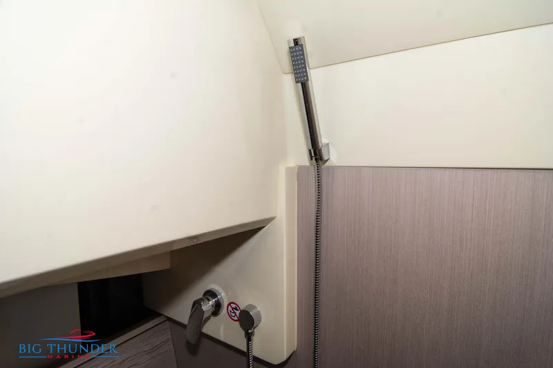 Slide: The Image of Interior of 2024 Invictus GT370S yacht featuring modern shower fixtures. - 54
