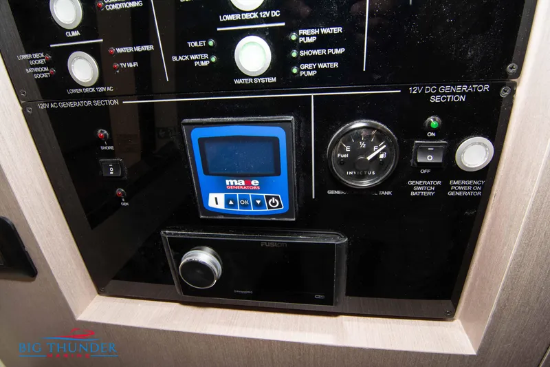 Slide: The Image of Control panel of 2024 Invictus GT370S boat with generator and fuel gauge. - 58