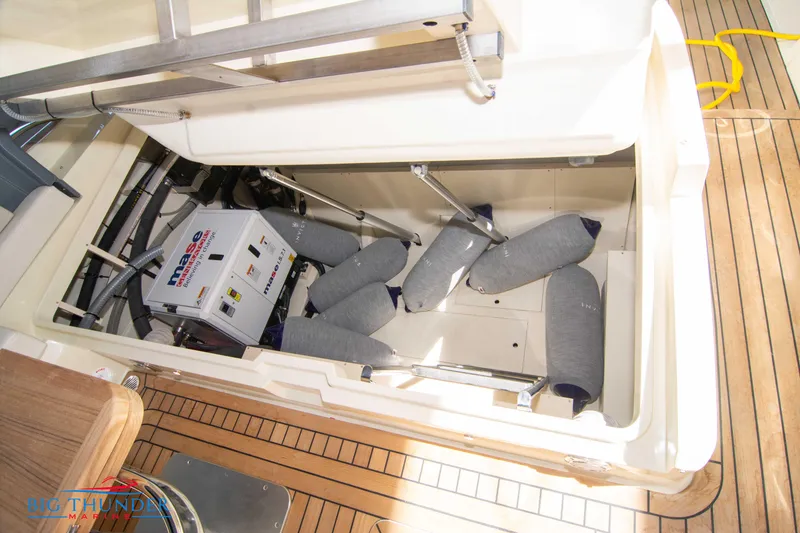 Slide: The Image of 2024 Invictus GT370S engine compartment with Mase generator and protective cushions. - 59