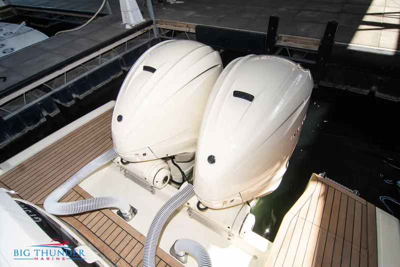 Slide: The Image of 2024 Invictus GT370S boat with dual outboard engines at dockside. - 8