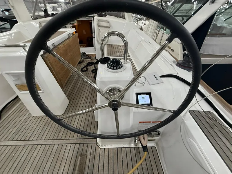 Slide: The Image of 2017 Beneteau Oceanis 38.1 yacht helm with steering wheel and navigation instruments. - 15