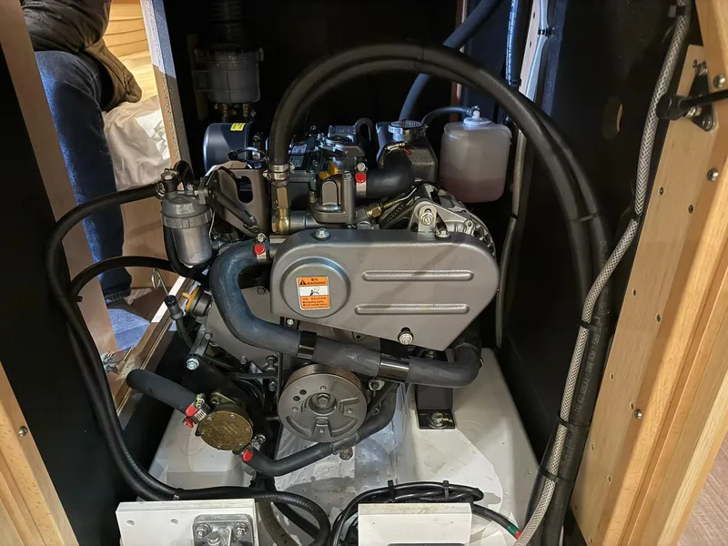 Slide: The Image of Engine compartment of a 2017 Beneteau Oceanis 38.1 sailboat, showcasing mechanical components. - 22