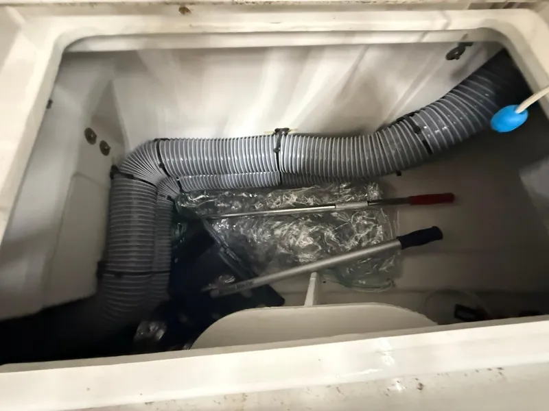 Slide: The Image of Storage compartment of 2017 Beneteau Oceanis 38.1 with hoses and tools. - 24