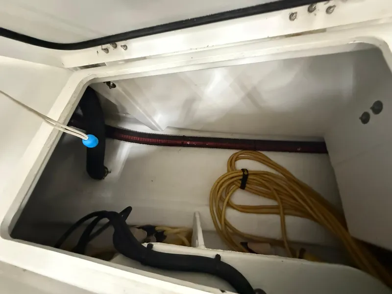 Slide: The Image of Storage compartment of a 2017 Beneteau Oceanis 38.1 sailboat with coiled rope. - 25