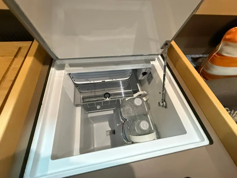 Slide: The Image of Open refrigerator compartment in 2017 Beneteau Oceanis 38.1 yacht galley. - 29