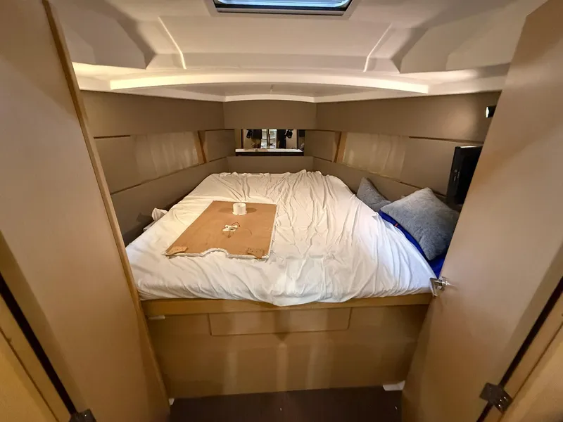 Slide: The Image of Cozy cabin interior of 2017 Beneteau Oceanis 38.1 yacht with comfortable bedding. - 31