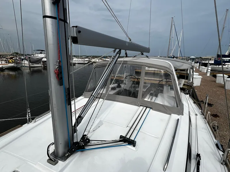 Slide: The Image of 2017 Beneteau Oceanis 38.1 sailboat docked at marina, showcasing deck and rigging. - 4