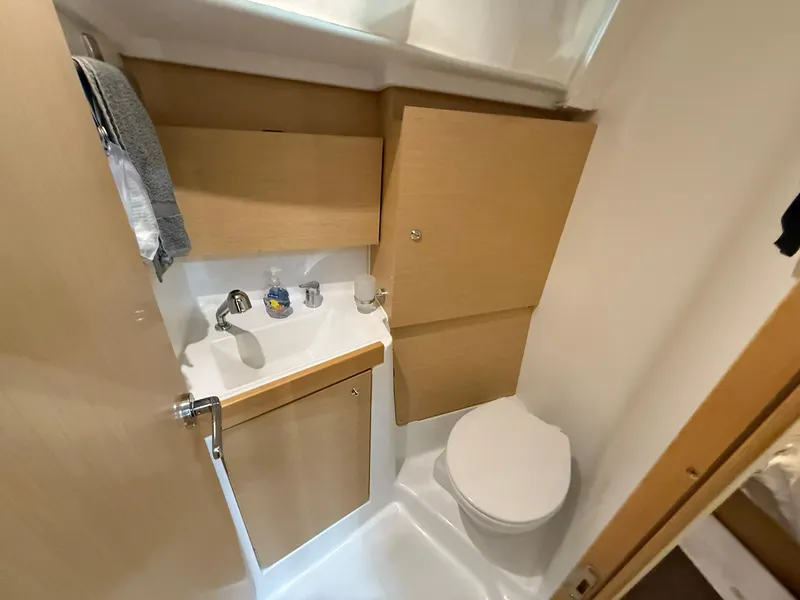 Slide: The Image of 2017 Beneteau Oceanis 38.1 bathroom with compact sink and toilet. - 42