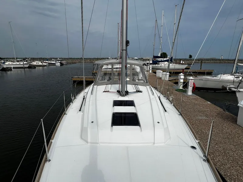 Slide: The Image of 2017 Beneteau Oceanis 38.1 sailboat docked at marina, view from bow. - 5