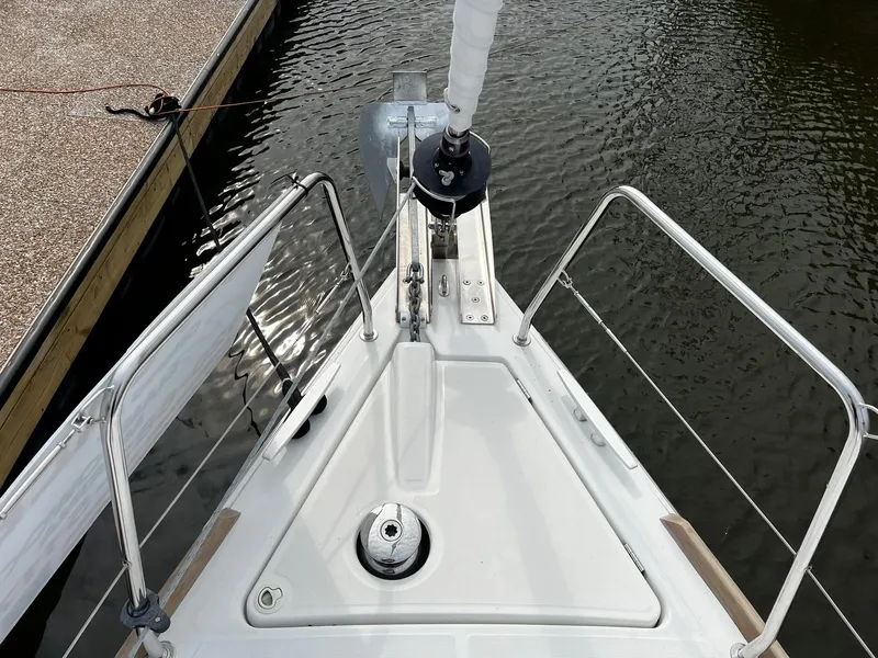 Slide: The Image of Bow view of 2017 Beneteau Oceanis 38.1 sailboat docked in calm waters. - 6