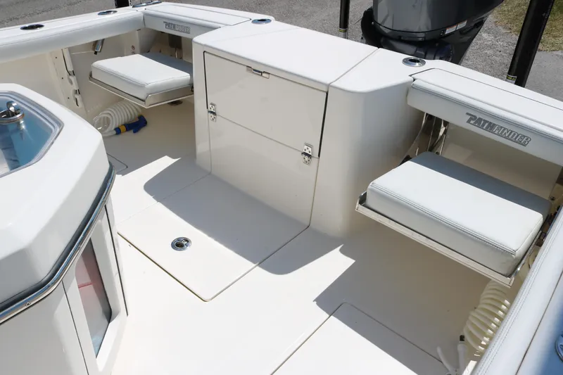 Slide: The Image of 2023 Pathfinder 2400TRS boat interior with seating and storage compartments. - 13
