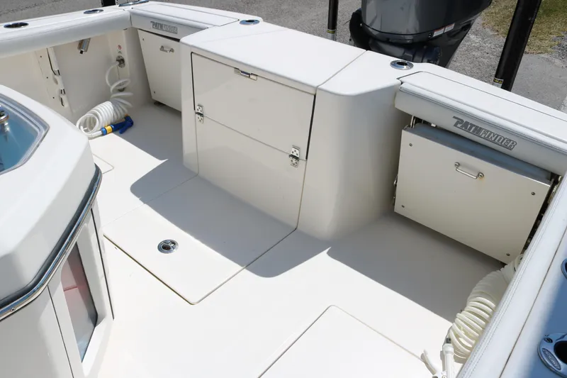 Slide: The Image of 2023 Pathfinder 2400TRS boat deck with storage compartments and clean design. - 14