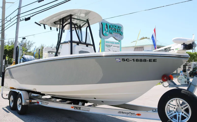 Slide: The Image of 2023 Pathfinder 2400TRS boat on trailer, displayed outdoors with signage in background. - 5