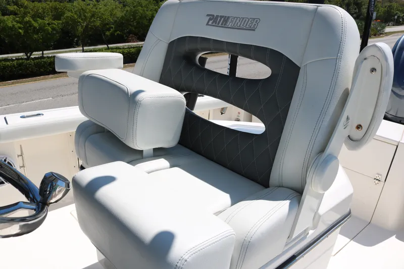Slide: The Image of 2023 Pathfinder 2400TRS boat seat with cushioned armrests and stylish design. - 7