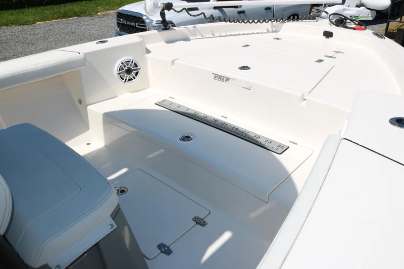 Slide: The Image of 2023 Pathfinder 2400TRS boat interior with seating and storage compartments. - 8