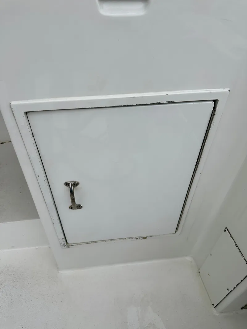 Slide: The Image of White storage compartment on 1994 Hatteras 46 Convertible boat. - 21