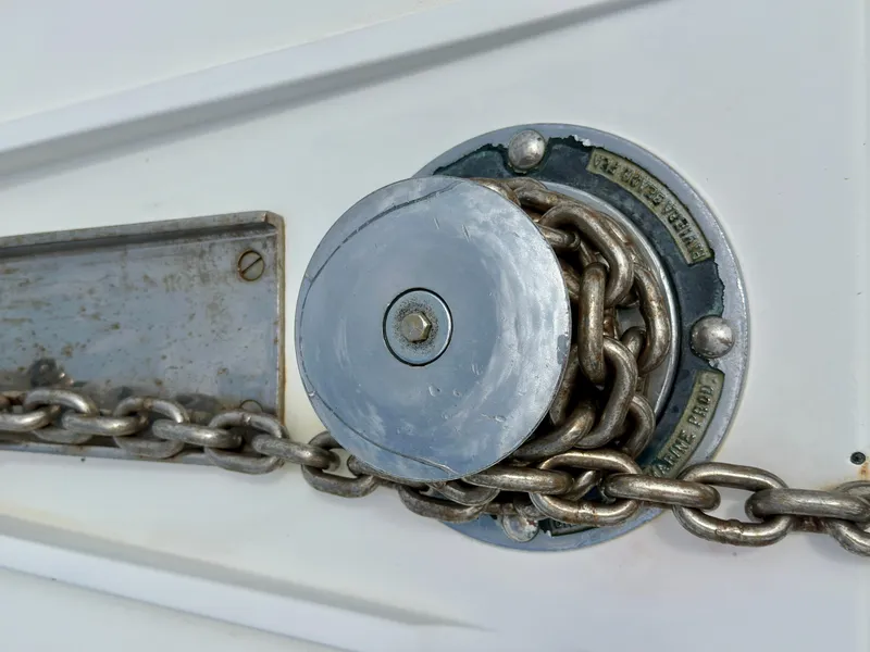 Slide: The Image of Anchor chain mechanism on a 1994 Hatteras 46 Convertible yacht. - 28