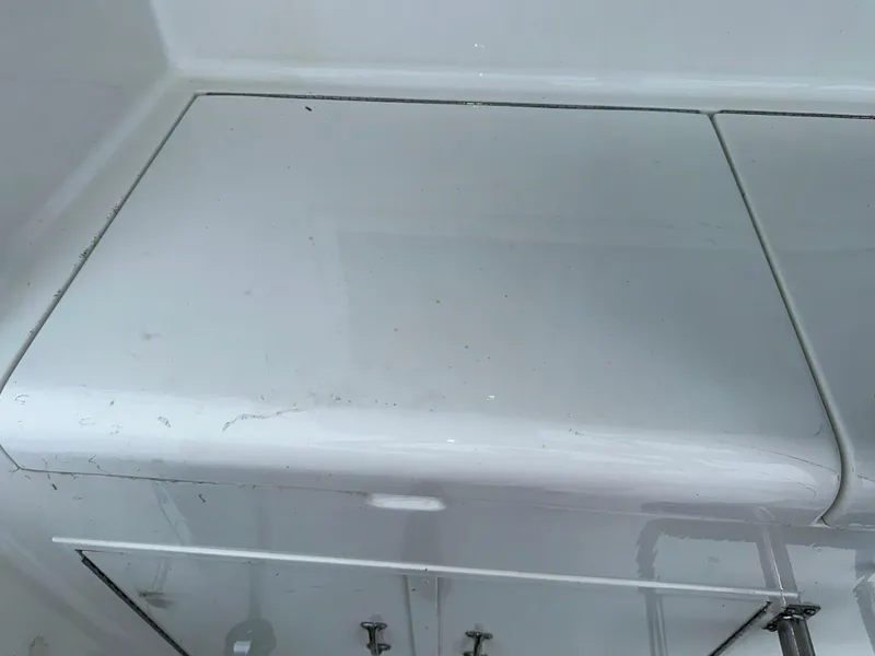 Slide: The Image of Hatteras 46 Convertible 1994 boat interior storage compartment with white finish. - 29