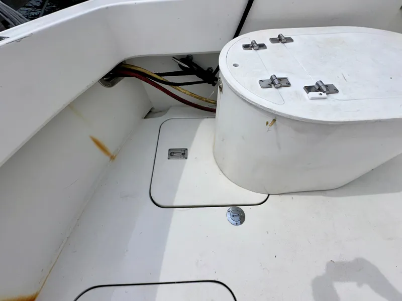 Slide: The Image of Hatteras 46 Convertible 1994 boat deck with storage compartments and utility access. - 33