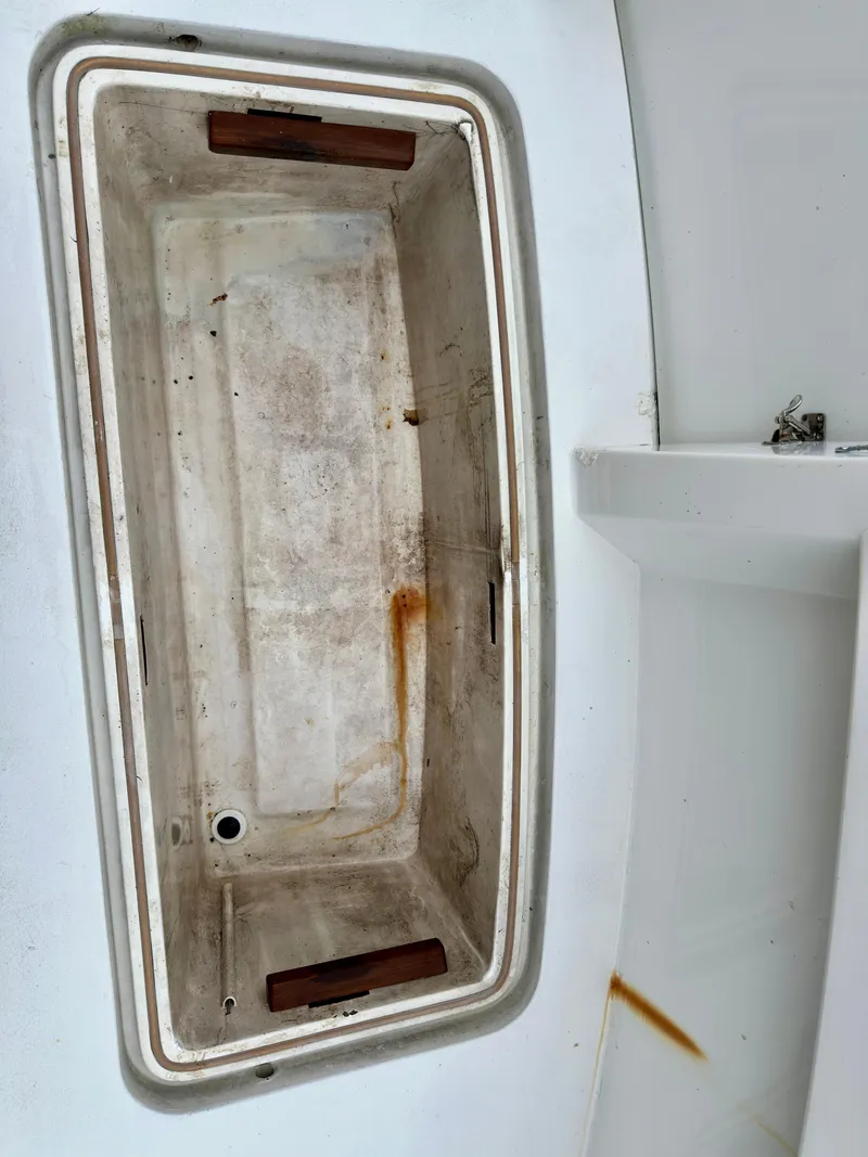 Slide: The Image of 1994 Hatteras 46 Convertible boat storage compartment, showing interior details and condition. - 39