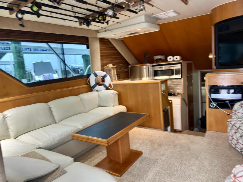 Slide: The Image of Interior of 1994 Hatteras 46 Convertible yacht with cozy seating and modern kitchen. - 70