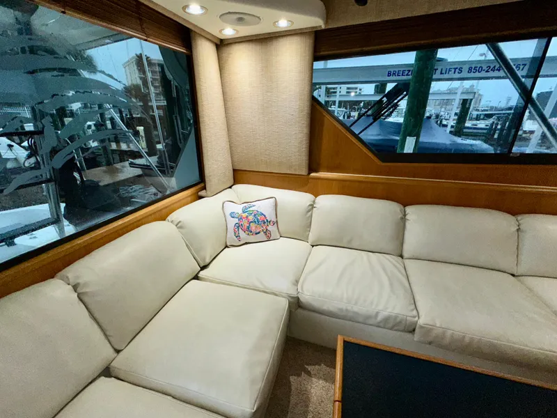 Slide: The Image of Luxurious interior of 1994 Hatteras 46 Convertible yacht with cream leather seating. - 72